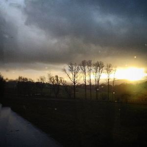 Scenic view of landscape against sky at sunset