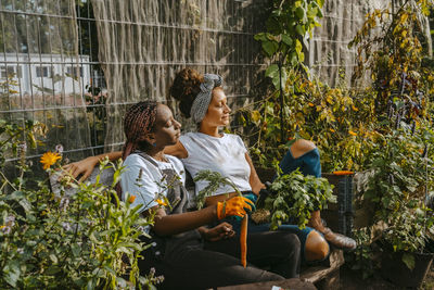 Female environmentalists relaxing in urban farm