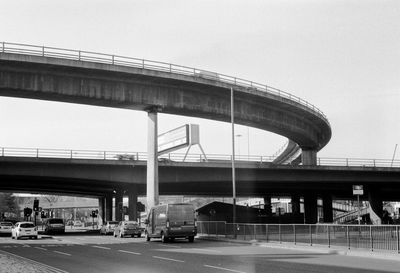 Bridge over road against clear sky