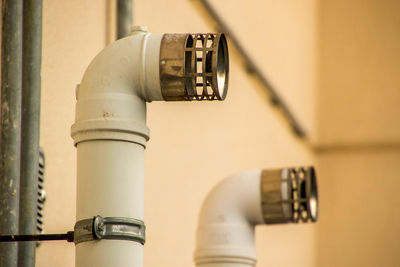 Close-up of pipes against wall