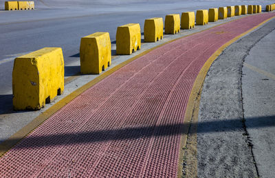 Yellow blocks delimit the pedestrian walkway through the port of heraklion