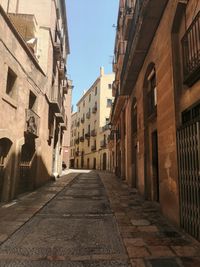 Narrow alley amidst buildings in city