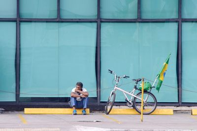 Full length of boy cycling bicycle