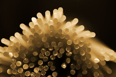 Close-up of raw pasta against black background