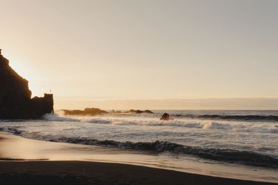 Scenic view of sea against clear sky during sunset