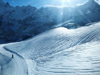 Scenic view of snow mountains against sky