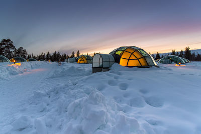 Scenic view of snow against sky during sunset