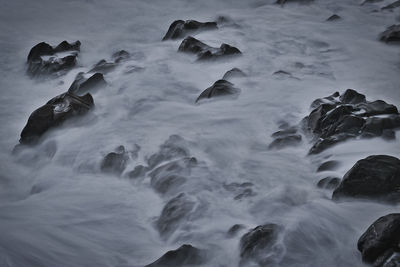 Blurred motion of rocks in sea