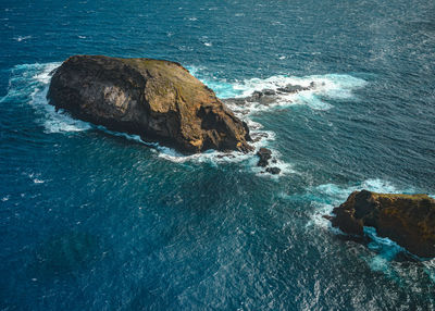 High angle view of rock formation in sea