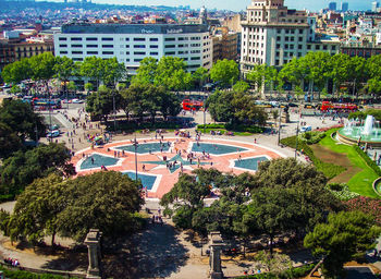 High angle view of trees and buildings in city