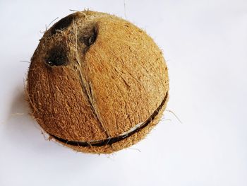 High angle view of bread on table against white background