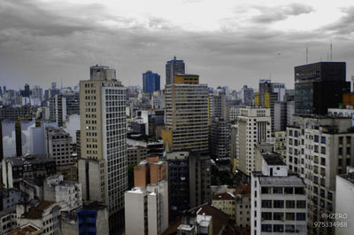 View of city against cloudy sky