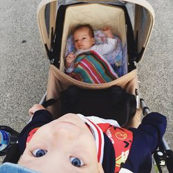 Portrait of cute boy sitting on floor