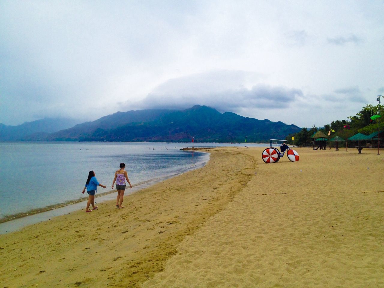 beach, water, sand, sea, sky, leisure activity, shore, mountain, lifestyles, vacations, scenics, beauty in nature, person, men, nature, tranquility, tranquil scene, cloud - sky, tourist