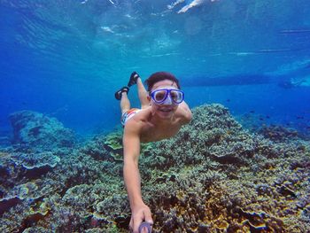 Close-up of man swimming in water