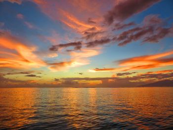 Scenic view of sea against orange sky