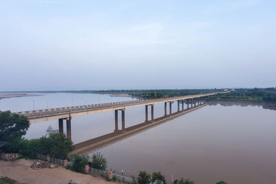 Bridge over river against sky