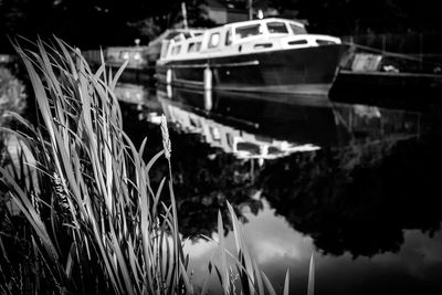 Close-up of boats moored in lake