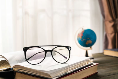 Close-up of eyeglasses on table at home