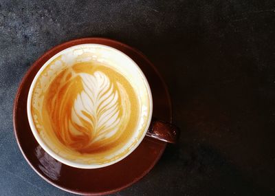 High angle view of coffee cup on table