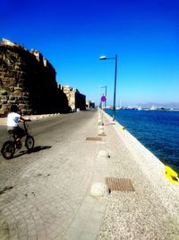 View of calm sea against clear blue sky