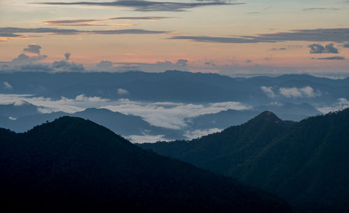 Scenic view of mountains against sky during sunset