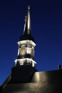 Low angle view of built structure against blue sky