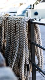 Close-up of ropes on railing