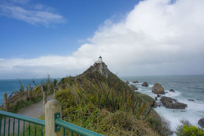 The iconic and historical nugget point light house in new zealand.