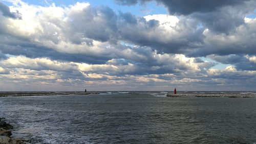 Scenic view of sea against storm clouds