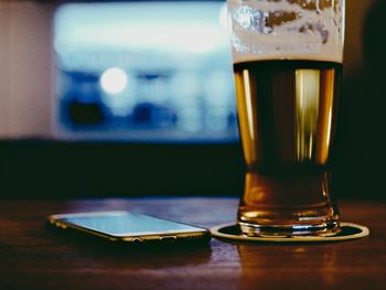Close-up of beer in glass on table