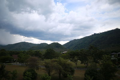 Scenic view of landscape and mountains against sky