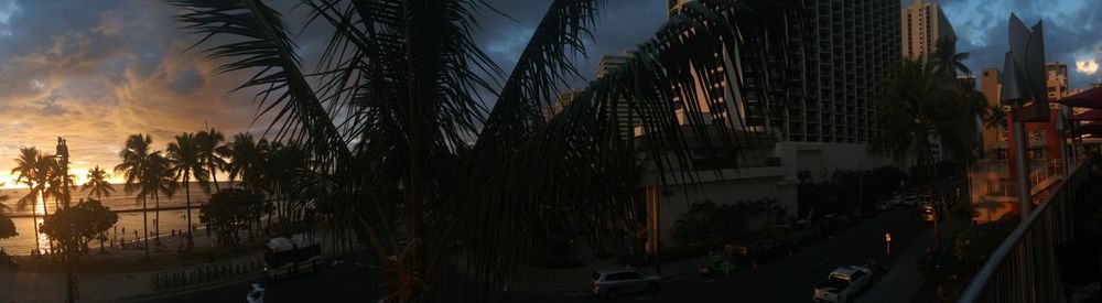 Panoramic view of city street at night