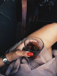 High angle view of woman sitting in car