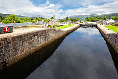 View of river and fort against sky