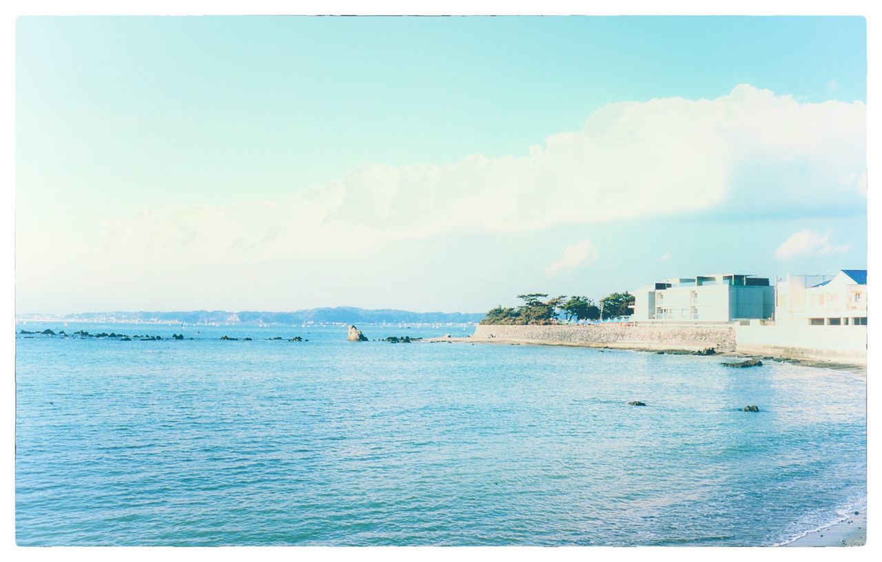 water, sky, sea, auto post production filter, waterfront, architecture, cloud - sky, transfer print, scenics - nature, built structure, beauty in nature, tranquil scene, day, building exterior, no people, blue, nature, tranquility, outdoors, horizon over water