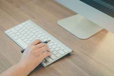 High angle view of person using laptop on table