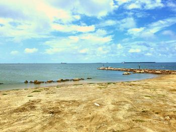 Scenic view of beach against sky