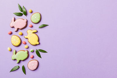 Directly above shot of pills on pink background