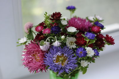 Close-up of purple flowers on table