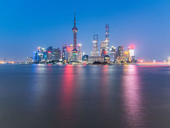 Illuminated buildings in city at night