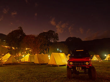 View of tent on field against sky at night