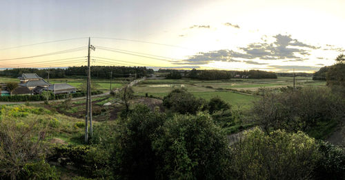 Scenic view of field against sky during sunset