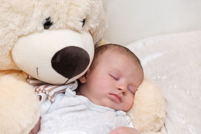 Cute baby sleeping in toy