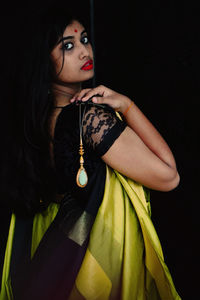 Portrait of a young woman looking away