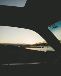 View of road seen through car window