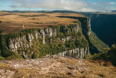 Fortaleza canyon with steep rocky cliffs covered by forest near cambará do sul. brazil.