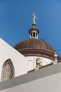 Low angle view of a building against blue sky