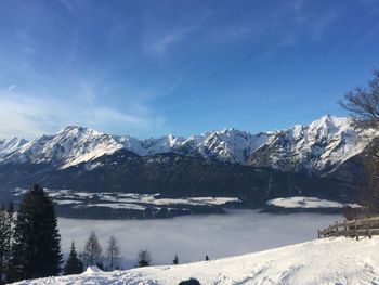 Scenic view of snow mountains against sky