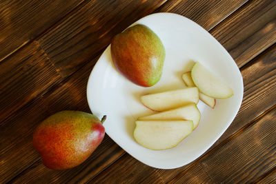 High angle view of fruits in plate on table